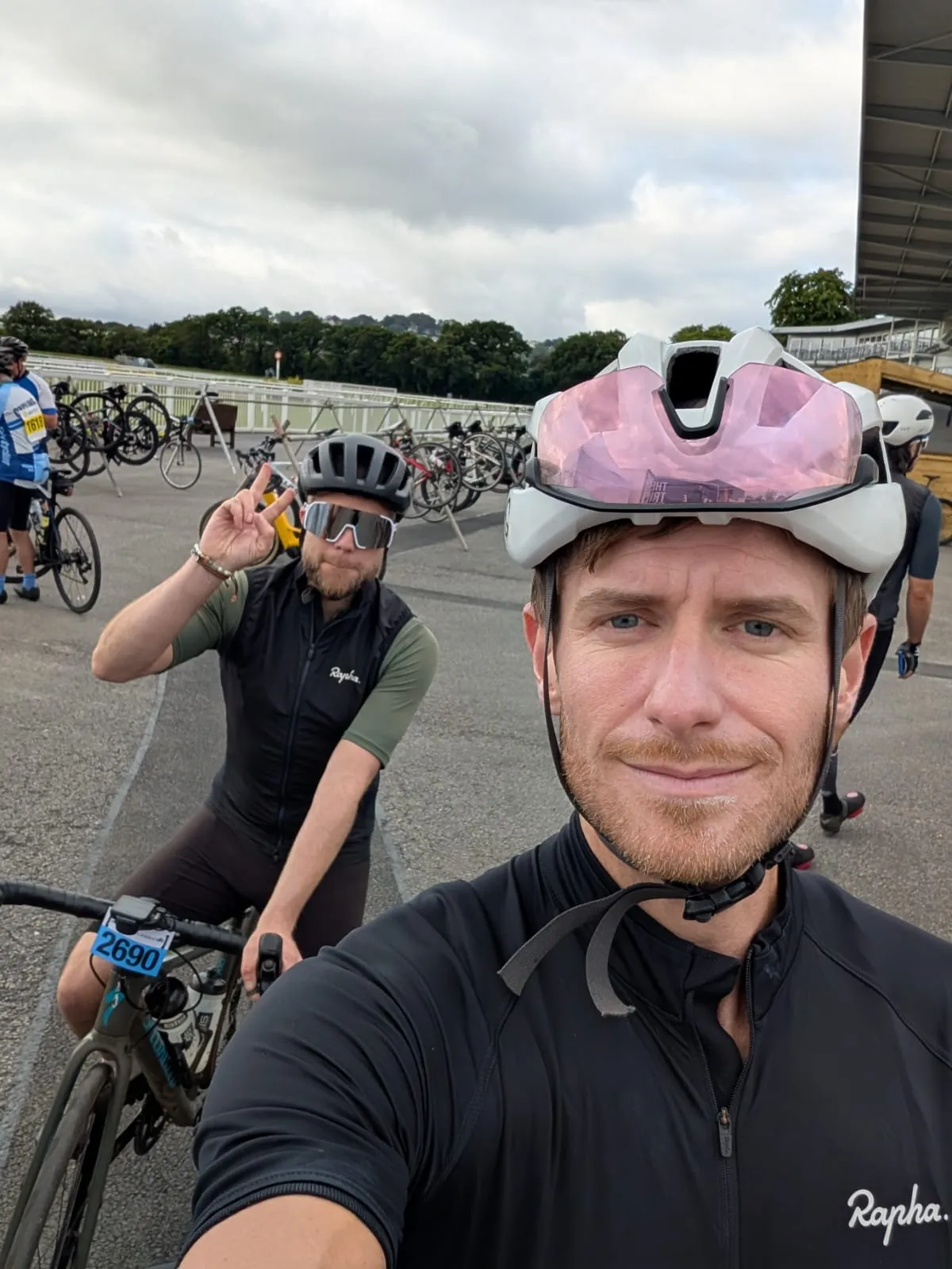 Selfie of the brothers at the Dartmoor Classic start area, one giving a peace sign from his bike